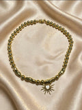 collar en forma de eclipse